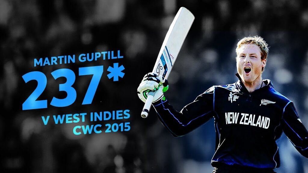 Martin Guptill raises bat after 237 not out in ODI World Cup match.